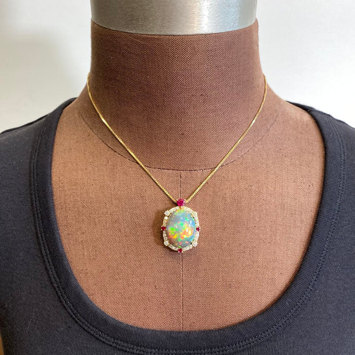 black opal pendant with rubies and diamonds