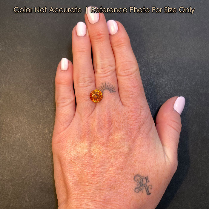 hessonite garnet round brilliant cut size to a hand