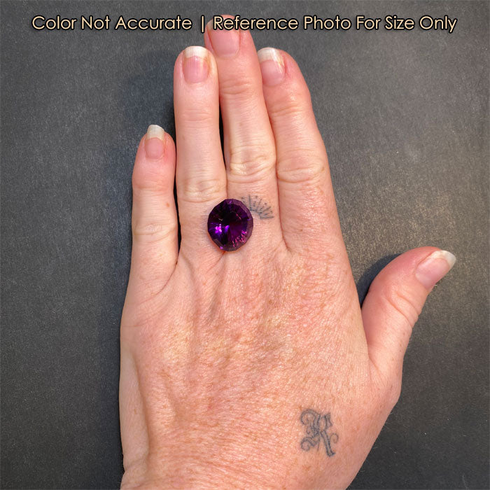 oval cut purple amethyst on hand