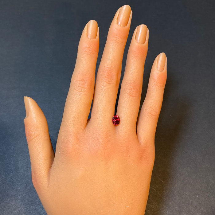 oval cut spinel gemstone orange red
