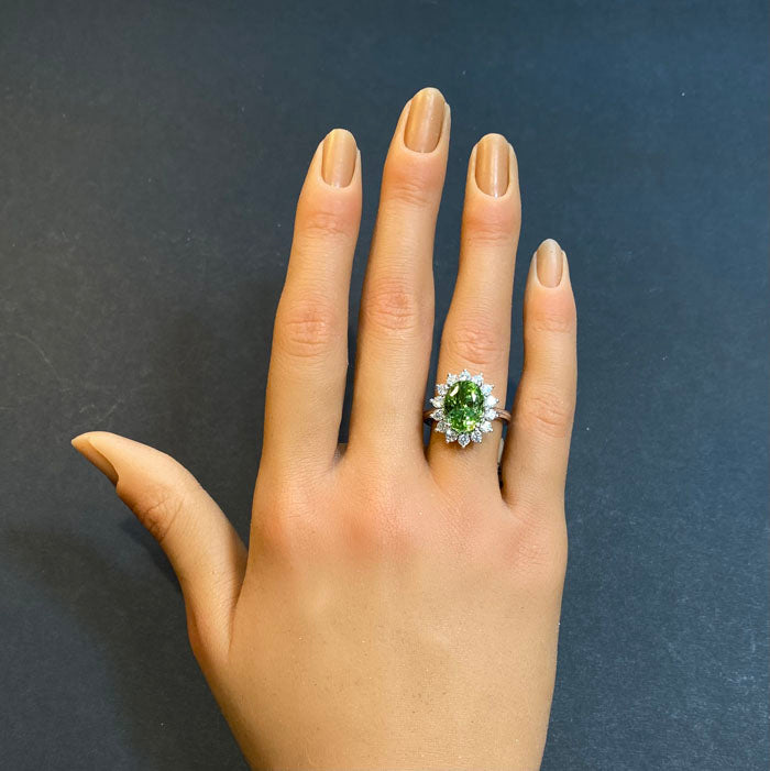 oval peridot with diamond halo white gold ring