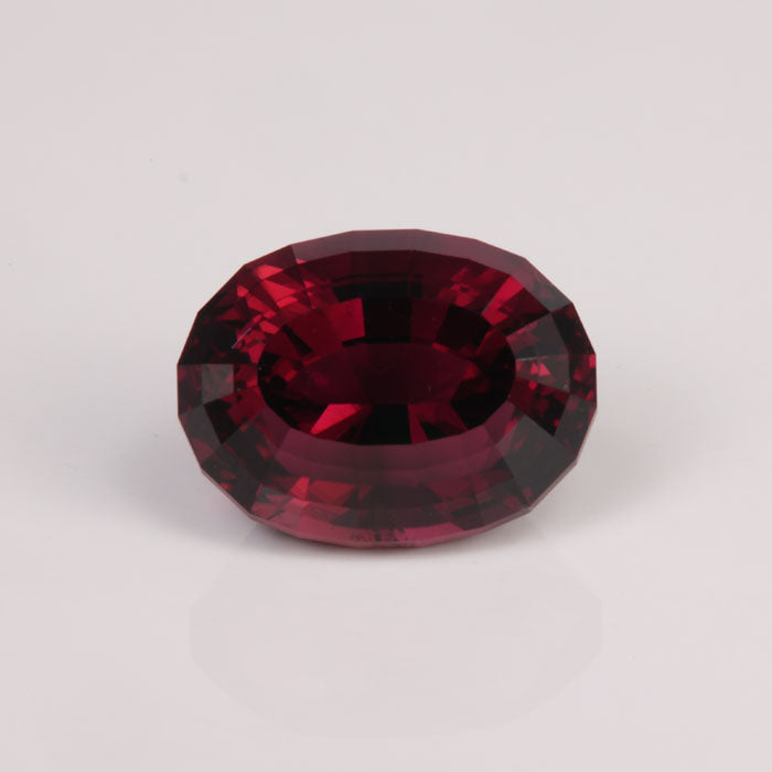 brownish red oval step cut tourmaline gemstone
