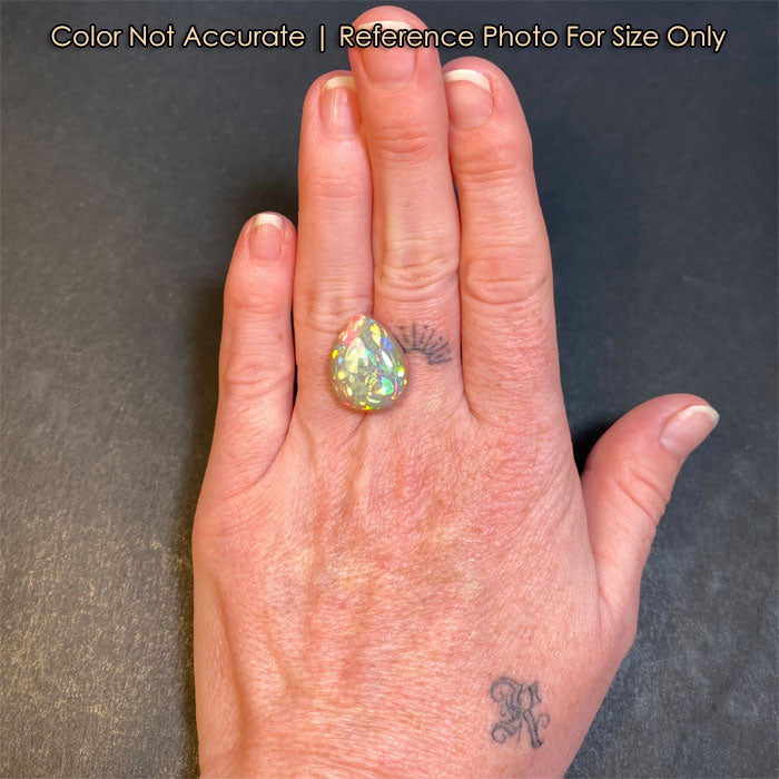 opal gemstone pear shape on hand