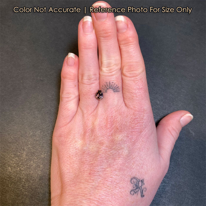 natural pear tanzanite on hand