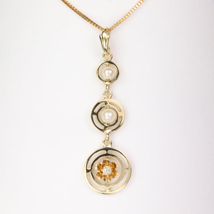 yellow gold and pearl diamond pendant