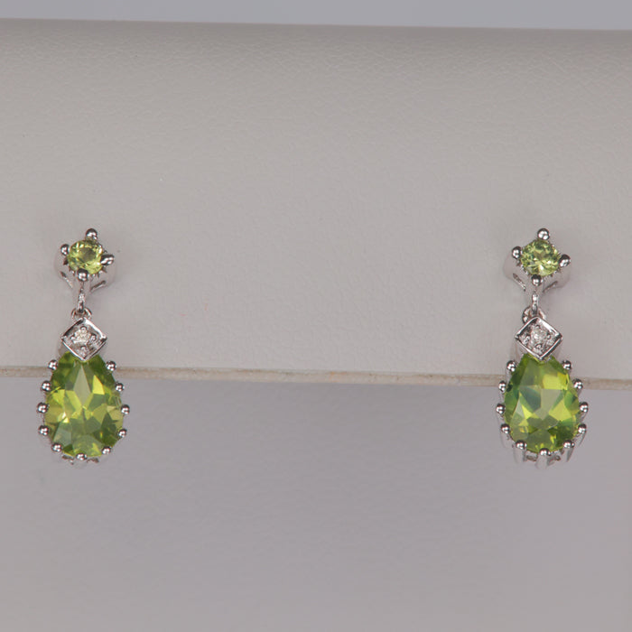 pear shape peridot earrings with diamond accents in white gold