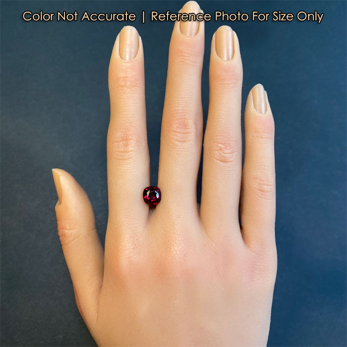 garnet gemstone on hand for size