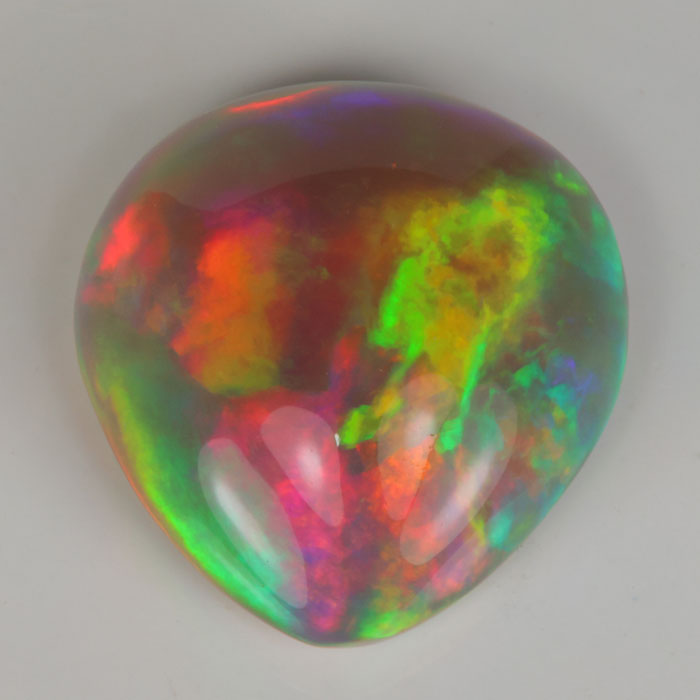 semi black opal rainbow colors pear shape gemstone