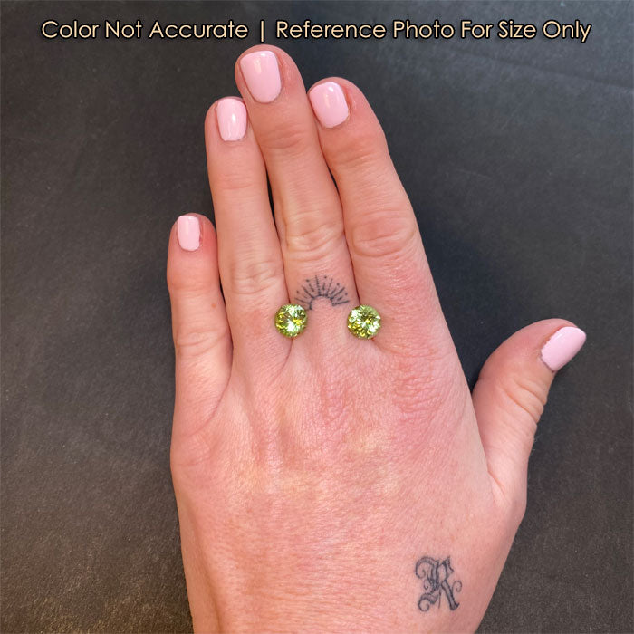 peridot gemstone pair mint green size to a hand