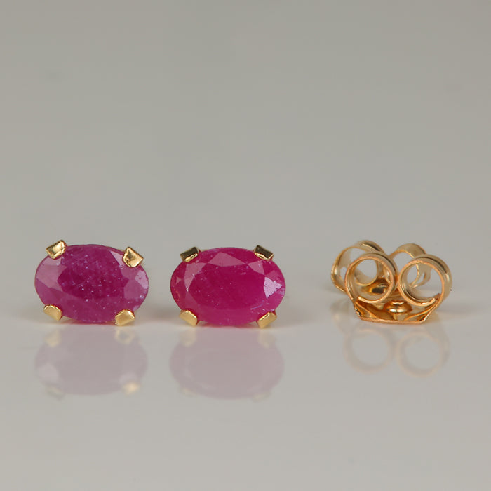 yellow gold oval ruby stud earrings