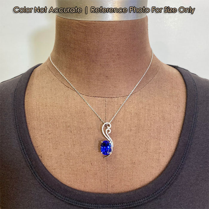 tanzanite and diamond pendant in white gold