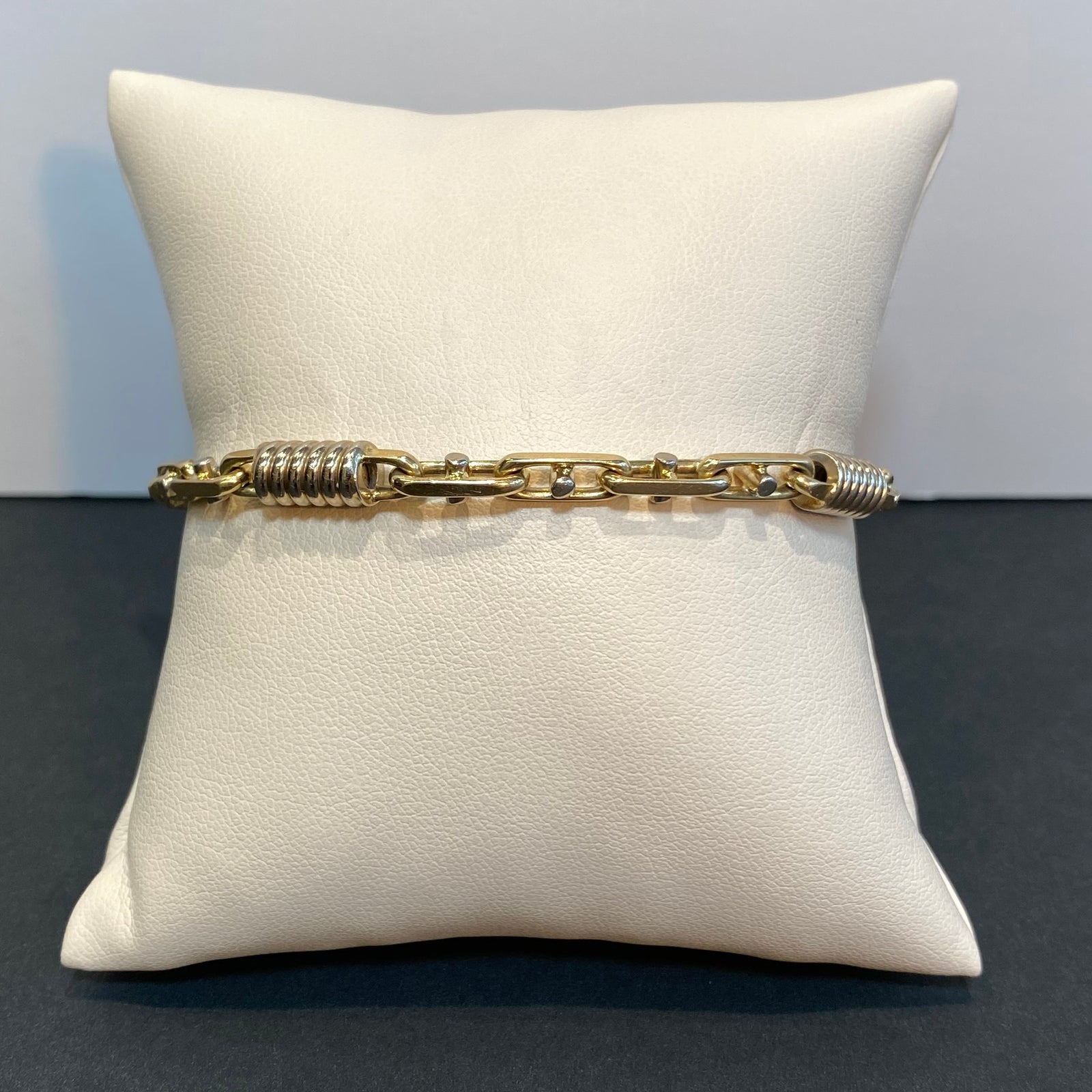 yellow gold chain link and spring bracelet