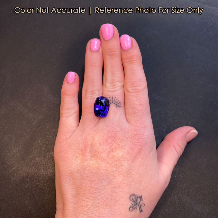 violet blue tanzanite gemstone on hand stepped cushion