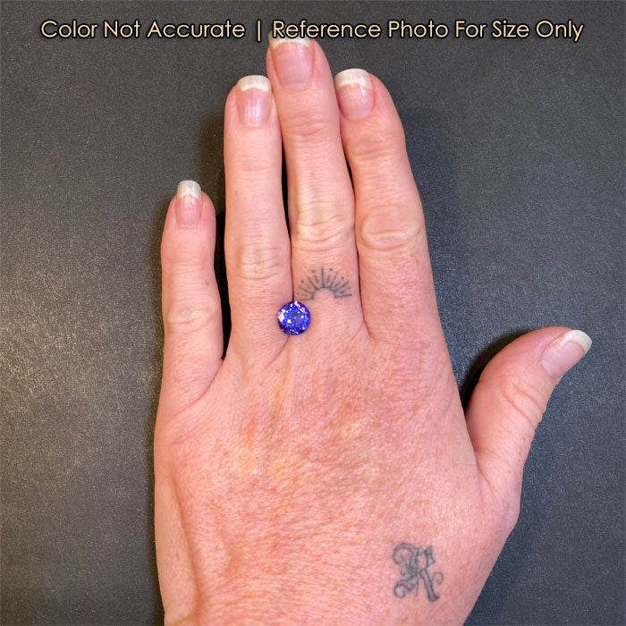 round tanzanite gemstone size to hand