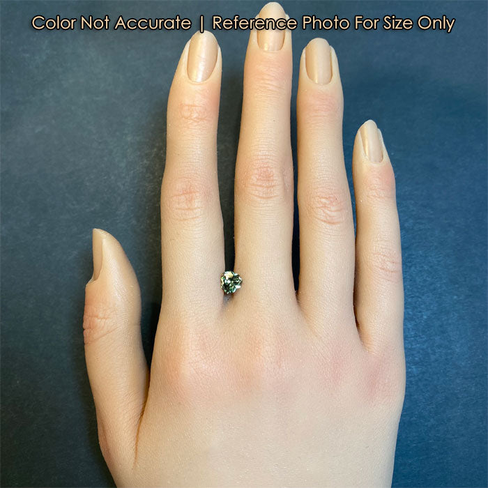 green color garnet gemstone on hand size