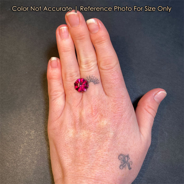 garnet gemstone size on hand violet red color