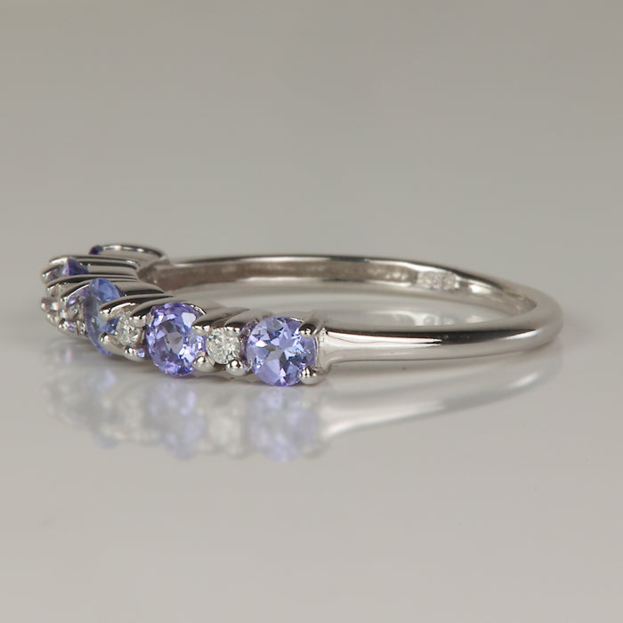 round brilliant cut tanzanite gemstone ring in white gold with diamonds