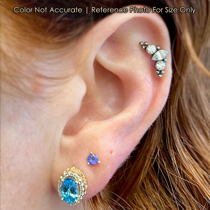 blue zircon and diamond earring in yellow gold