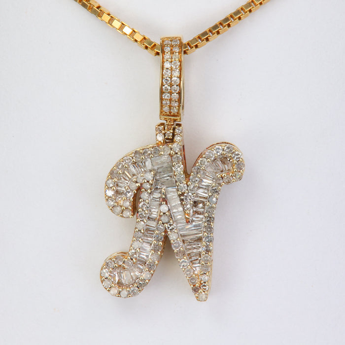 gold and diamond letter N pendant