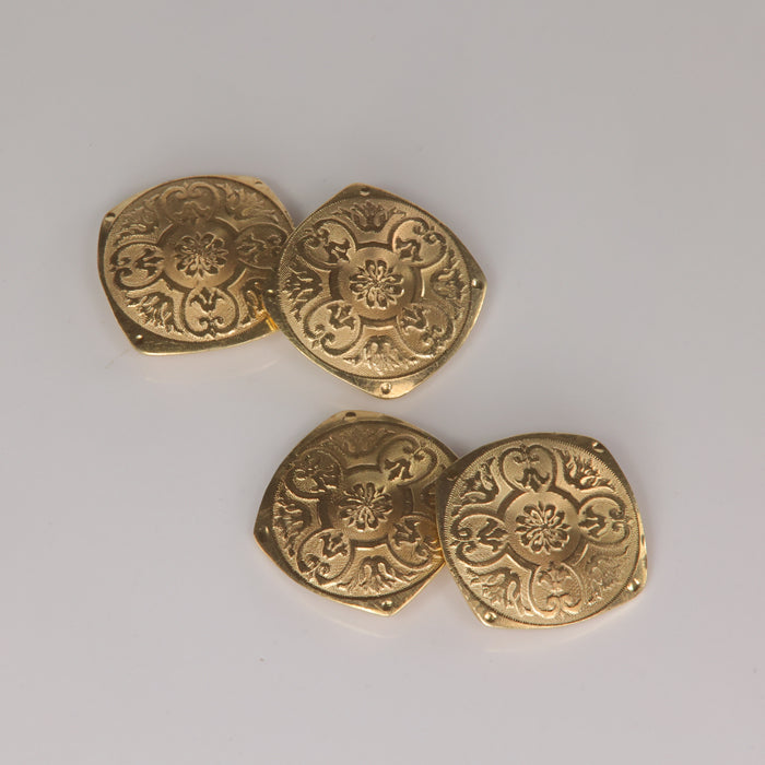 yellow gold pair of double sided cufflinks with design
