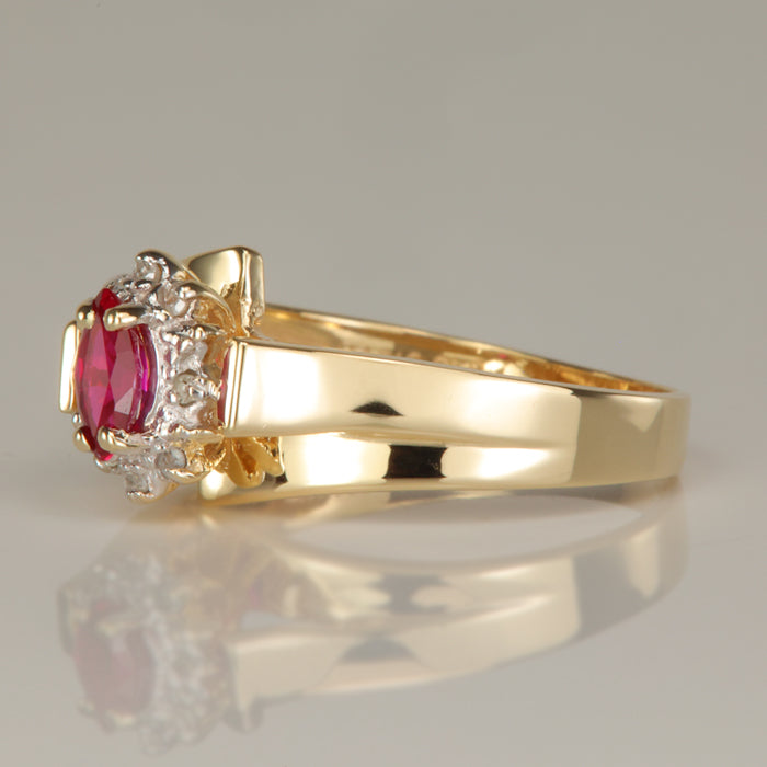 synthetic ruby and diamond accent ring in yellow gold