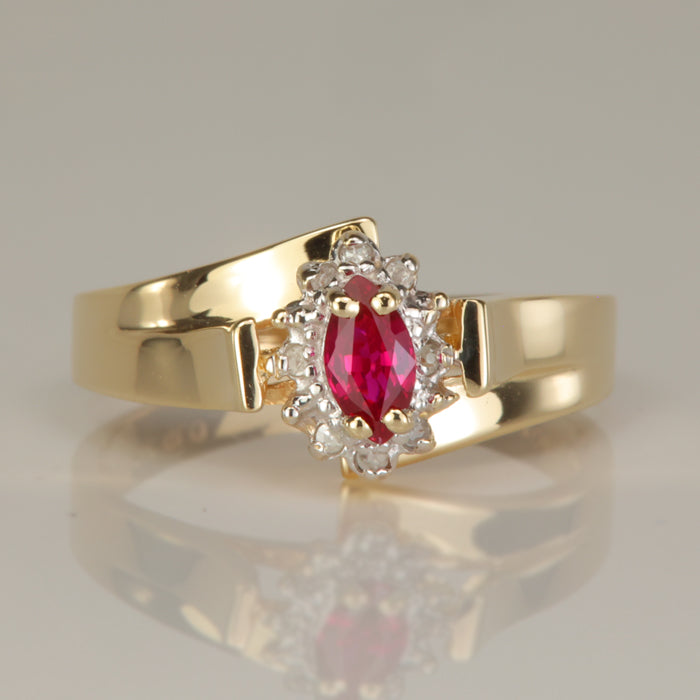yellow gold ring with synthetic ruby and diamond accents
