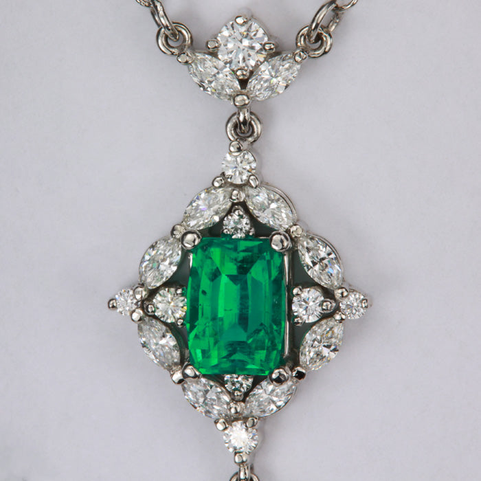 beautiful emerald and diamond pendant in platinum