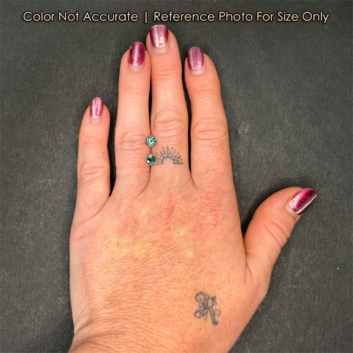 size of sapphire pair to hand
