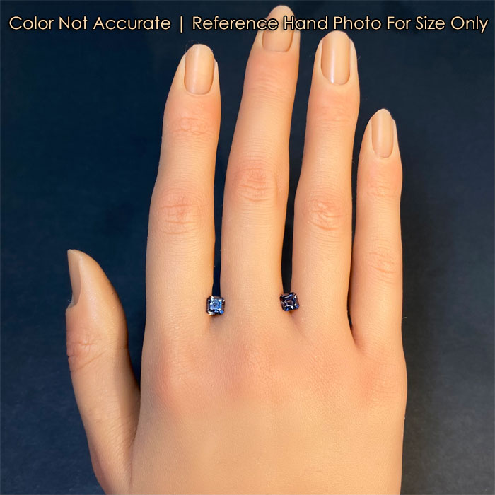 gray spinel gemstones on hand 