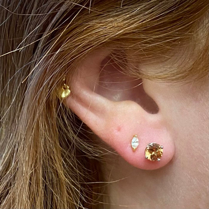 zircon earrings on ear