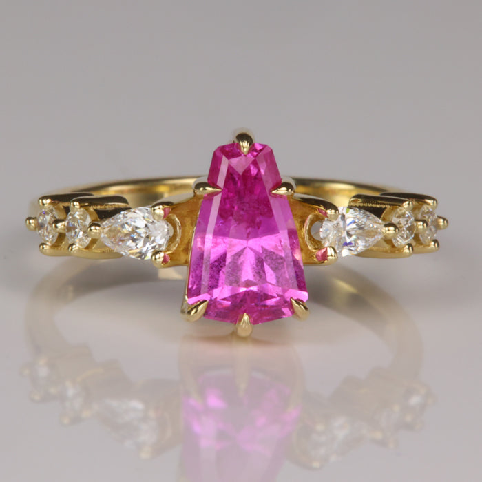pink color sapphire gemstone ring in yellow gold with diamonds