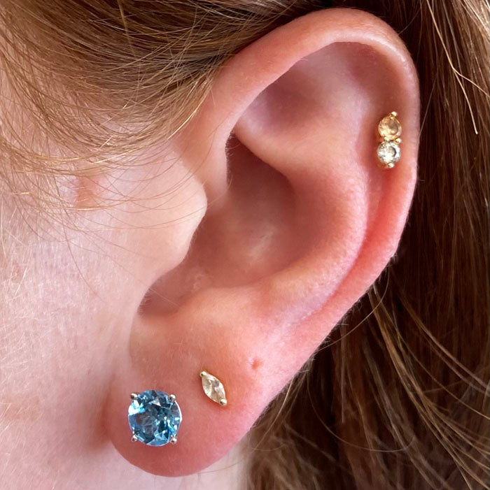swiss blue topaz earrings studs white gold