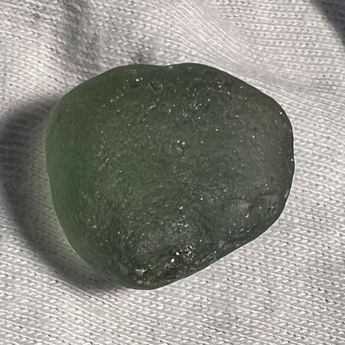 green tourmaline rough before