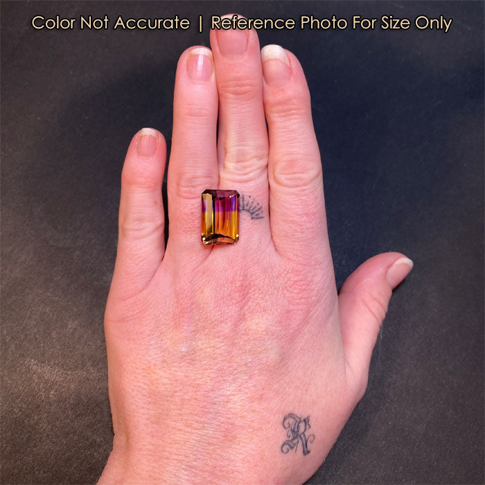ametrine bicolor gem on hand