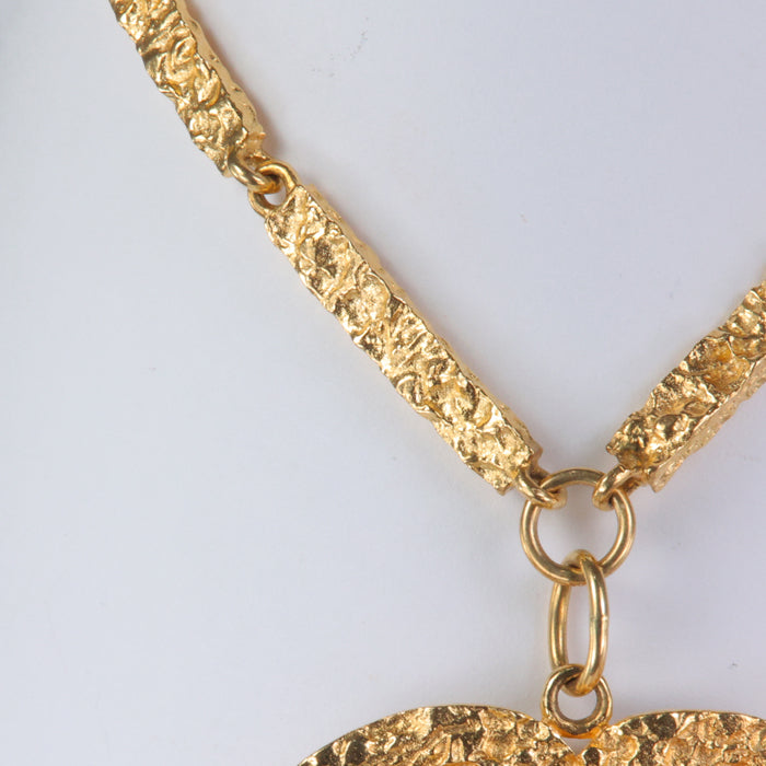 yellow gold necklace with a .48oz 24k gold coin 