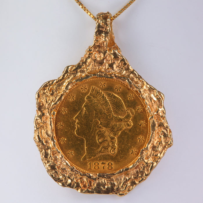 1878 coin with .97oz pure 24k gold set in 14k yellow gold 