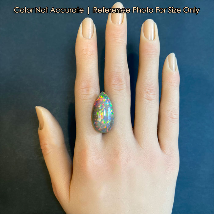 black opal pear shape on hand 