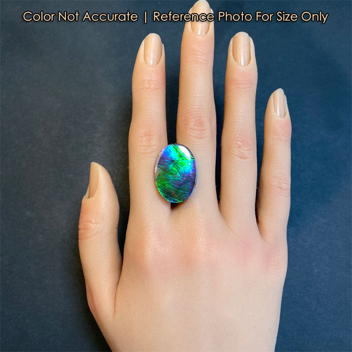 green blue color ammolite gem on hand