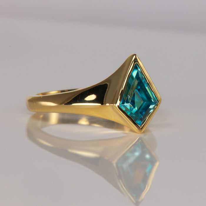 blue zircon ring in yellow gold