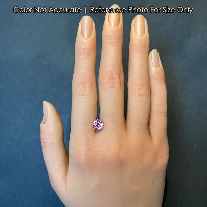 pink color spinel gem on hand size reference 
