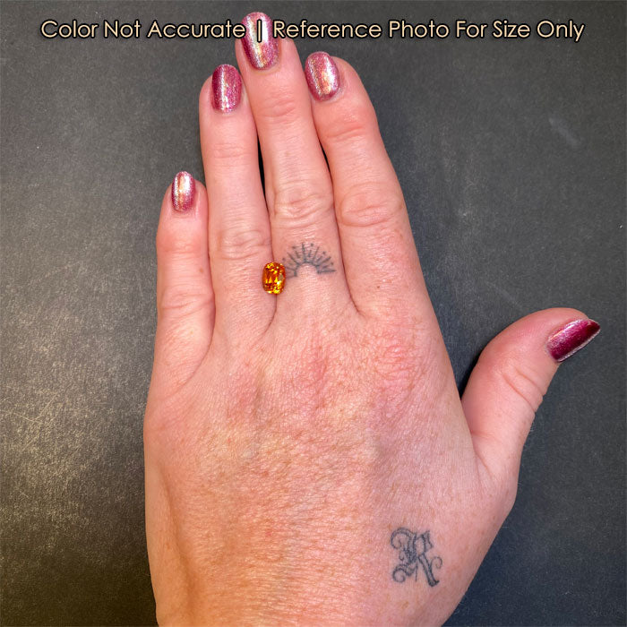 spessartite orange garnet on hand size