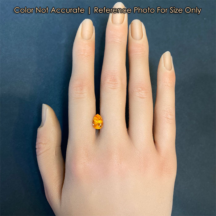 orange color spessartite garnet gem on hand