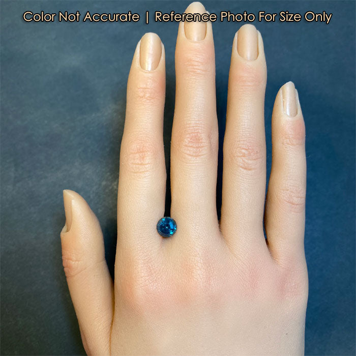 blue green round sapphire gemstone size to hand