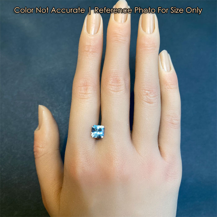 light green sapphire gem size to a hand