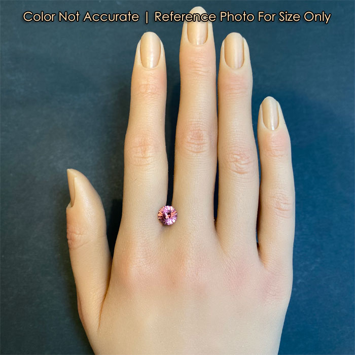 pink malaya garnet gem on hand size