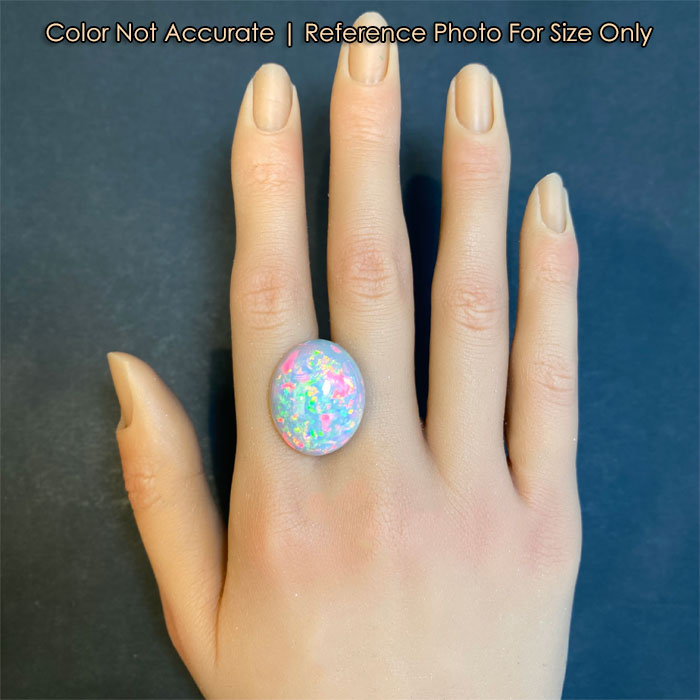 oval cut semi black opal size on a hand