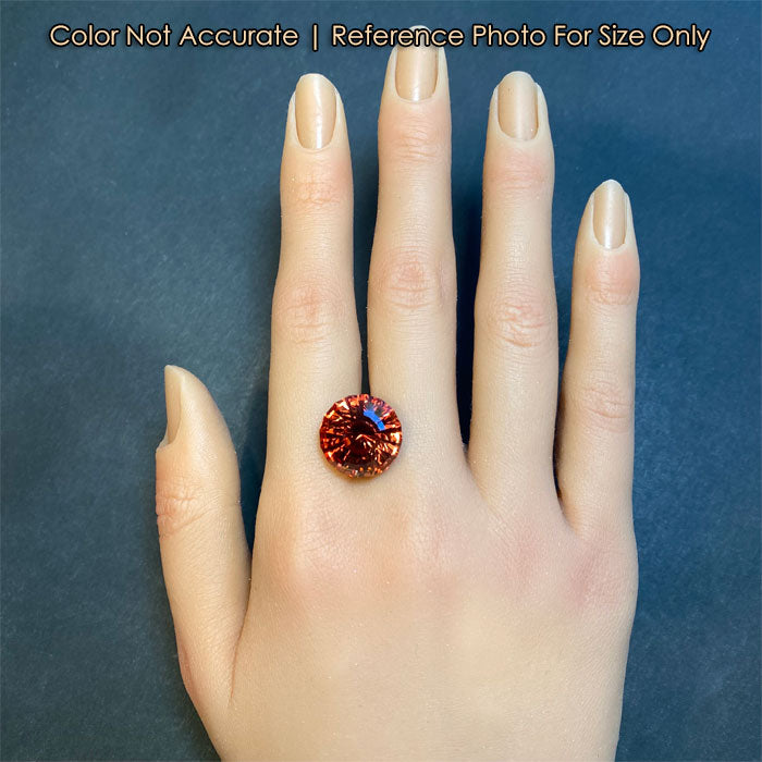pinkish red orange garnet size to a hand