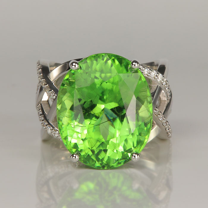 mint green peridot gemstone ring with diamonds in white gold