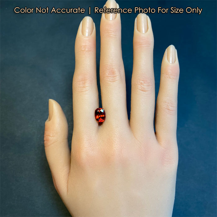 spessartite red orange garnet gem on hand