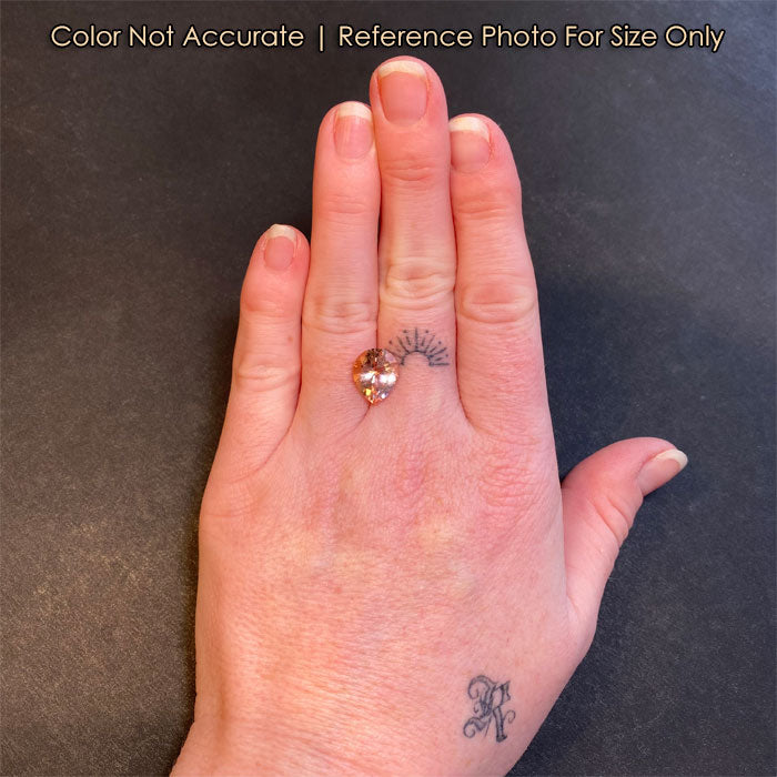 peach color pear shape Morganite on hand